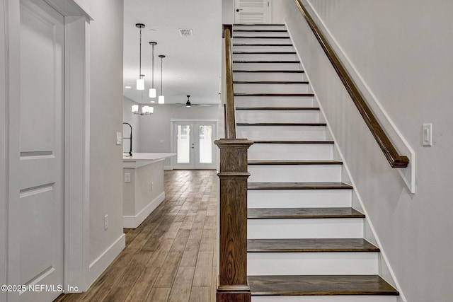 335 5th Ave S, Jacksonville Beach, FL 32250 - stairs with a ceiling fan, visible vents, baseboards, and wood finished floors