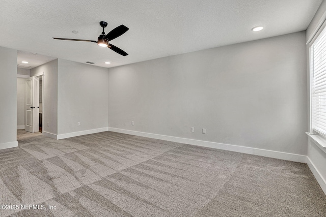 335 5th Ave S, Jacksonville Beach, FL 32250 - empty room featuring baseboards, a textured ceiling, carpet, and a ceiling fan