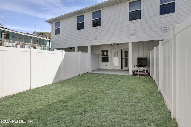 335 5th Ave S, Jacksonville Beach, FL 32250 - rear view of house featuring cooling unit, a fenced backyard, a yard, and a patio