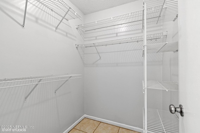 7927 Dwyer Dr, Jacksonville, FL 32244 - spacious closet featuring light tile patterned flooring