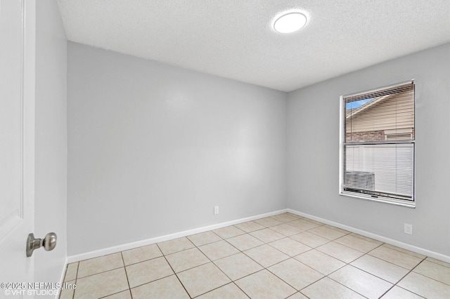 7927 Dwyer Dr, Jacksonville, FL 32244 - unfurnished room featuring baseboards and a textured ceiling