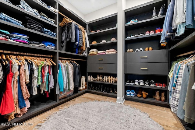126 Seahill Dr, Saint Augustine, FL 32092 - walk in closet featuring wood finished floors