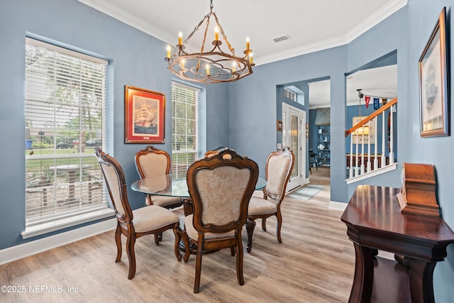 1053 Anchor Rd, Saint Johns, FL 32259 - dining area with stairway, an inviting chandelier, ornamental molding, visible vents, and light wood-style flooring