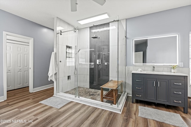 1053 Anchor Rd, Saint Johns, FL 32259 - full bathroom with a shower stall, wood finished floors, ceiling fan, and vanity