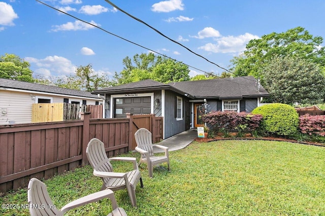1202 Wolfe St, Jacksonville, FL 32205 - back of house featuring an attached garage