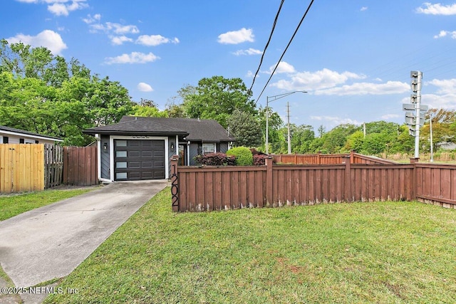 1202 Wolfe St, Jacksonville, FL 32205 - view of yard with concrete driveway and a garage