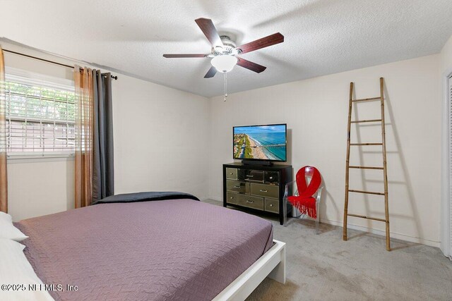 1202 Wolfe St, Jacksonville, FL 32205 - bedroom featuring carpet floors, ceiling fan, and a textured ceiling