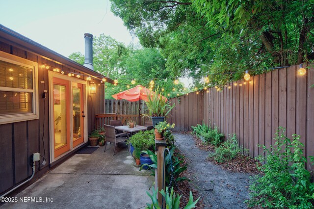 1202 Wolfe St, Jacksonville, FL 32205 - view of patio featuring a fenced backyard and outdoor dining space