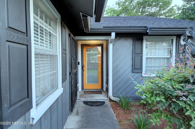 1202 Wolfe St, Jacksonville, FL 32205 - property entrance with a shingled roof