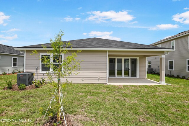 107 Arbor Alcove Ln, Saint Augustine, FL 32084 - back of house featuring central air condition unit, a lawn, and a patio area
