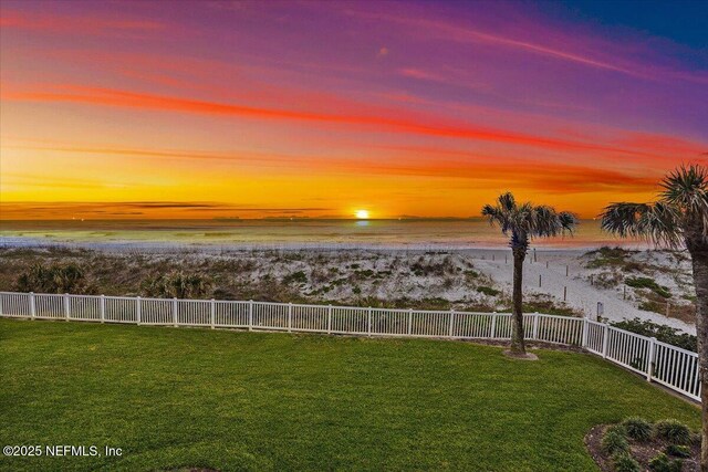 701 Beach Ave Unit 204, Atlantic Beach, FL 32233 - view of yard with a fenced backyard, a view of the beach, and a water view