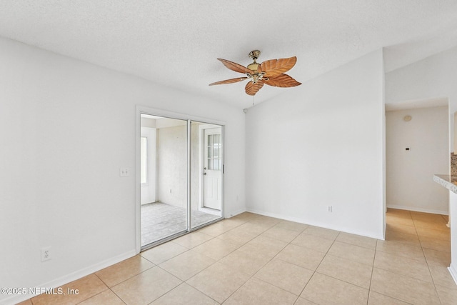 104 Seaside Cir, Ponte Vedra Beach, FL 32082 - spare room with ceiling fan, light tile patterned flooring, baseboards, and a textured ceiling
