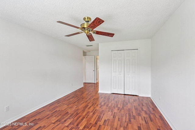 104 Seaside Cir, Ponte Vedra Beach, FL 32082 - unfurnished bedroom with wood finished floors, baseboards, a closet, and a textured ceiling