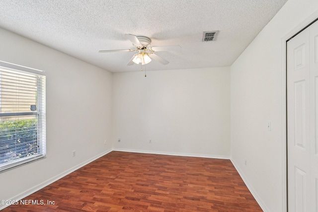 104 Seaside Cir, Ponte Vedra Beach, FL 32082 - empty room featuring a ceiling fan, wood finished floors, a textured ceiling, and baseboards