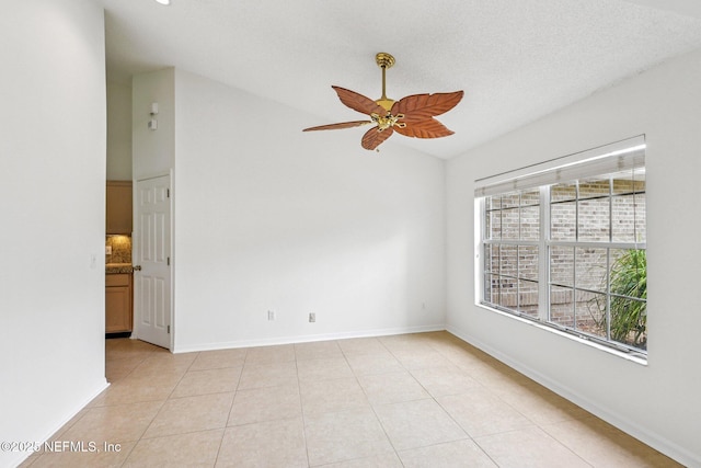 104 Seaside Cir, Ponte Vedra Beach, FL 32082 - unfurnished room with light tile patterned floors, ceiling fan, baseboards, and high vaulted ceiling