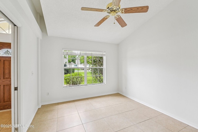 104 Seaside Cir, Ponte Vedra Beach, FL 32082 - unfurnished room featuring vaulted ceiling, light tile patterned floors, a ceiling fan, a textured ceiling, and baseboards