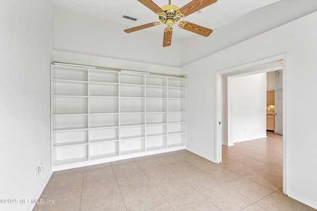 104 Seaside Cir, Ponte Vedra Beach, FL 32082 - unfurnished room featuring light tile patterned flooring, built in features, a ceiling fan, and baseboards