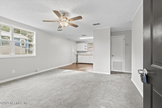 161 W 65th St, Jacksonville, FL 32208 - unfurnished living room with baseboards, visible vents, a ceiling fan, and dark colored carpet