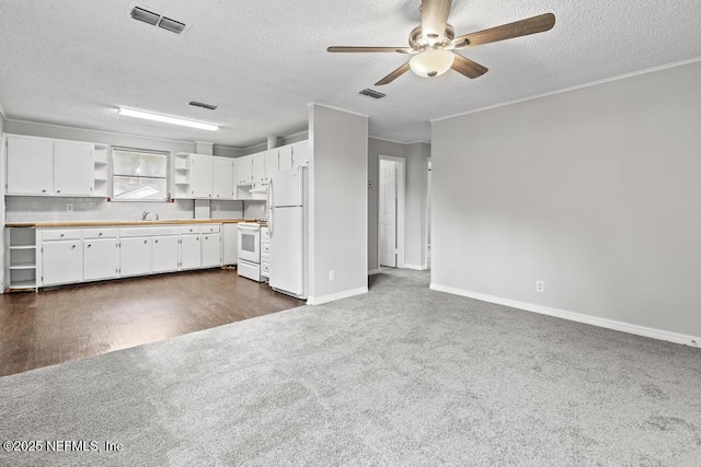 161 W 65th St, Jacksonville, FL 32208 - kitchen featuring ceiling fan, visible vents, open shelves, and white appliances
