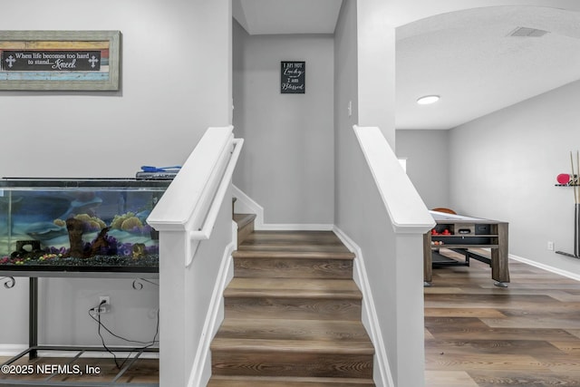 141 Casa Sevilla Ave, Saint Augustine, FL 32092 - stairway with visible vents, baseboards, and wood finished floors