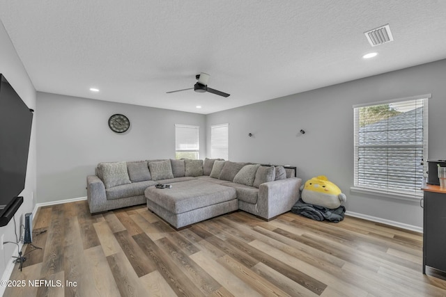141 Casa Sevilla Ave, Saint Augustine, FL 32092 - living area featuring plenty of natural light, visible vents, and wood finished floors