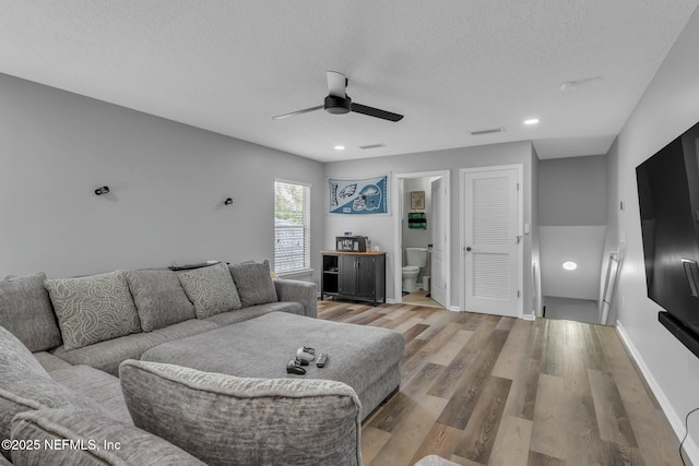 141 Casa Sevilla Ave, Saint Augustine, FL 32092 - living area featuring visible vents, a textured ceiling, a ceiling fan, and wood finished floors