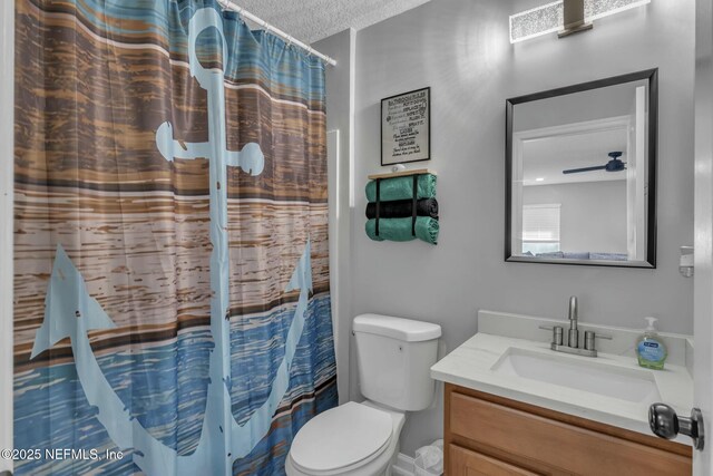 141 Casa Sevilla Ave, Saint Augustine, FL 32092 - bathroom with toilet, a textured ceiling, vanity, and a shower with curtain