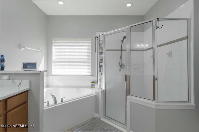 141 Casa Sevilla Ave, Saint Augustine, FL 32092 - bathroom featuring a shower stall, a garden tub, vanity, and recessed lighting