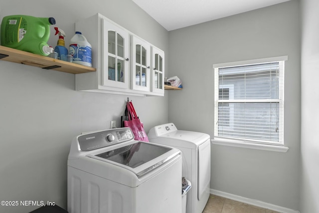141 Casa Sevilla Ave, Saint Augustine, FL 32092 - washroom featuring laundry area, light tile patterned floors, baseboards, and washer and clothes dryer