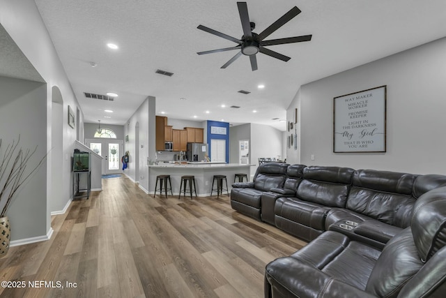 141 Casa Sevilla Ave, Saint Augustine, FL 32092 - living room with visible vents, baseboards, wood finished floors, and ceiling fan