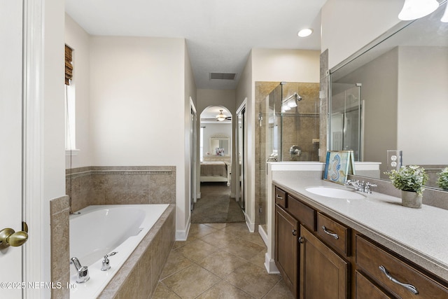 ensuite bathroom featuring tile patterned floors, a stall shower, visible vents, a garden tub, and ensuite bathroom