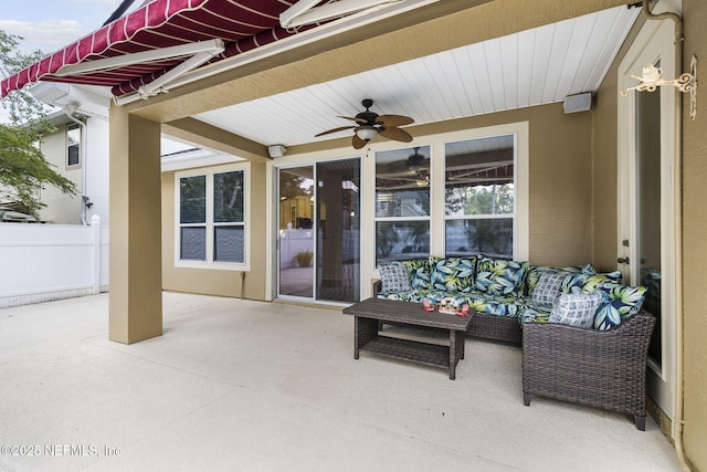 view of patio featuring fence and ceiling fan