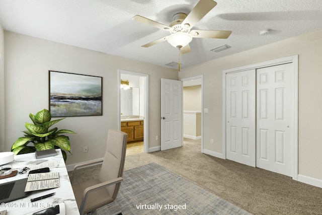office area featuring ceiling fan, baseboards, light carpet, and visible vents