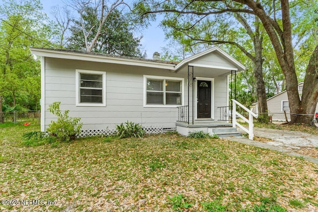 3051 4th Street Cir, Jacksonville, FL 32254 - view of front of property featuring a front yard and fence