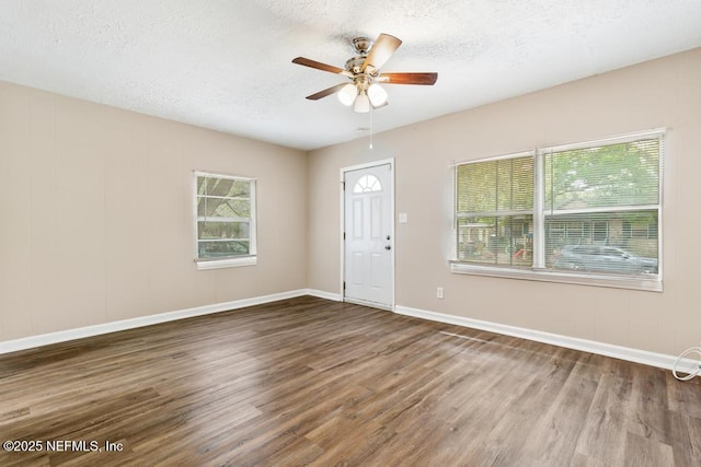 3051 4th Street Cir, Jacksonville, FL 32254 - entrance foyer with a ceiling fan, a textured ceiling, baseboards, and wood finished floors