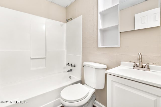 3051 4th Street Cir, Jacksonville, FL 32254 - full bath with toilet, vanity, tile walls, and bathing tub / shower combination