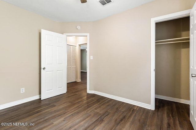 3051 4th Street Cir, Jacksonville, FL 32254 - unfurnished bedroom featuring dark wood-style flooring, baseboards, a closet, and visible vents