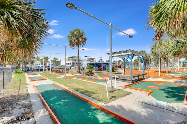 96086 Sea Winds Dr, Fernandina Beach, FL 32034 - surrounding community with an area to practice putting, a pergola, and fence