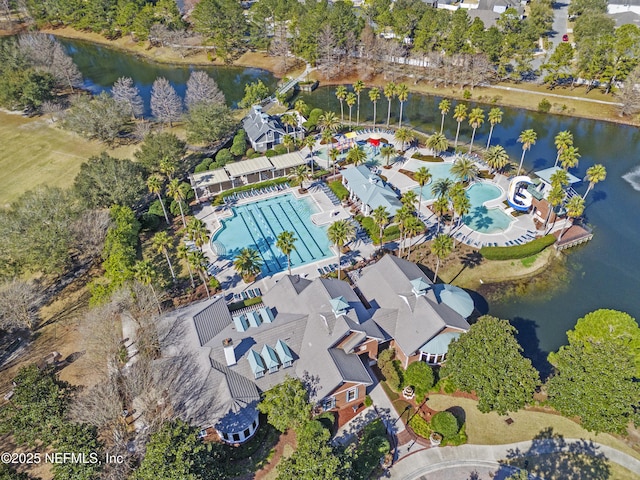 drone / aerial view with a residential view and a water view