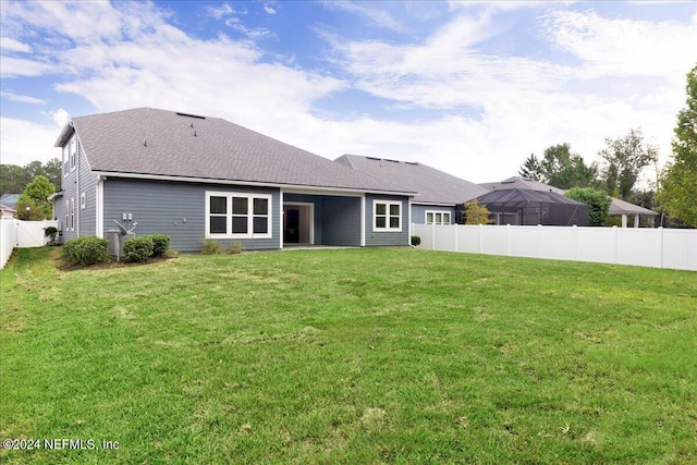 113 Footbridge Rd, Saint Johns, FL 32259 - rear view of house featuring a fenced backyard, a shingled roof, and a yard