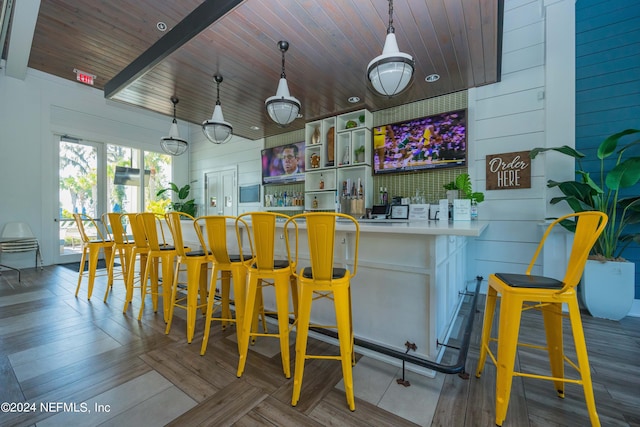 113 Footbridge Rd, Saint Johns, FL 32259 - bar featuring hanging light fixtures, wooden walls, wood finished floors, and wood ceiling