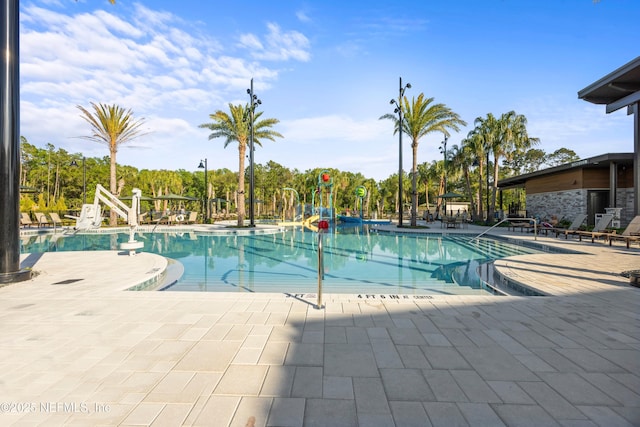 113 Footbridge Rd, Saint Johns, FL 32259 - pool featuring a water play area, a water slide, and a patio area