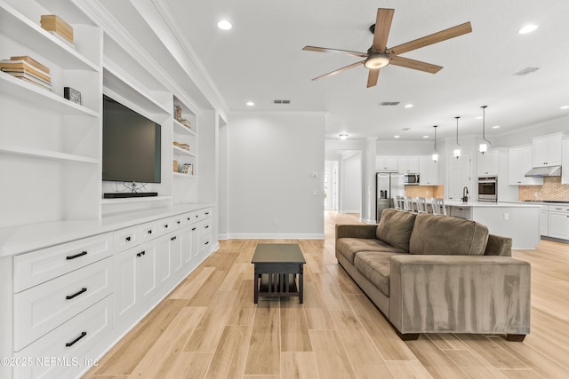 113 Footbridge Rd, Saint Johns, FL 32259 - living room featuring visible vents, crown molding, light wood-style floors, and ceiling fan