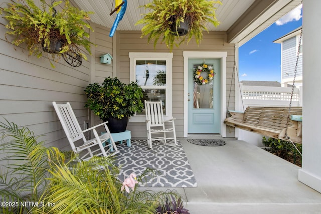 property entrance with covered porch