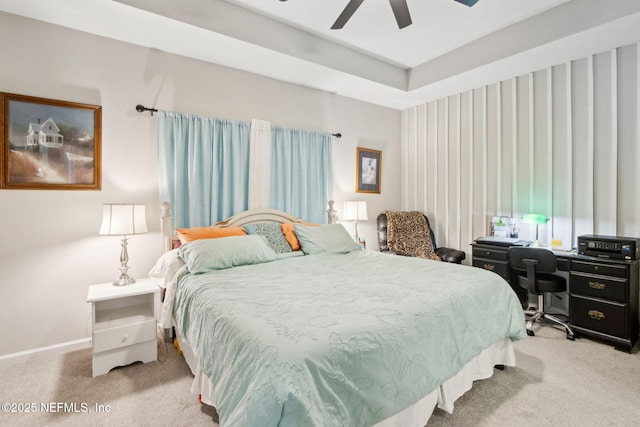 carpeted bedroom featuring a ceiling fan and baseboards