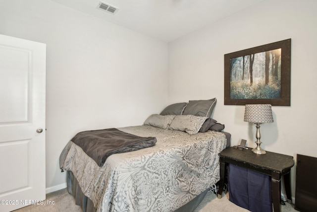 bedroom featuring baseboards, carpet floors, and visible vents