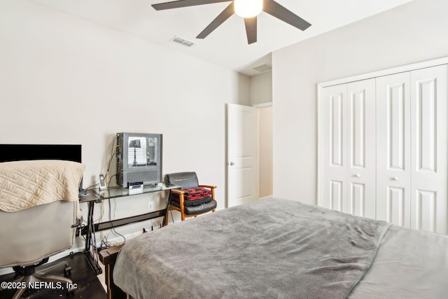 bedroom with visible vents, a closet, and ceiling fan
