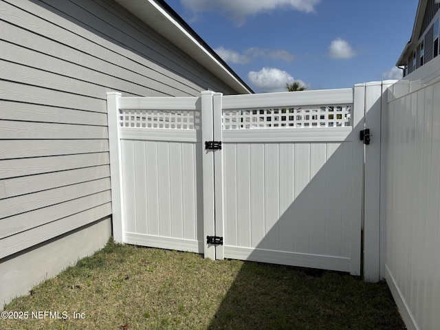view of gate featuring fence