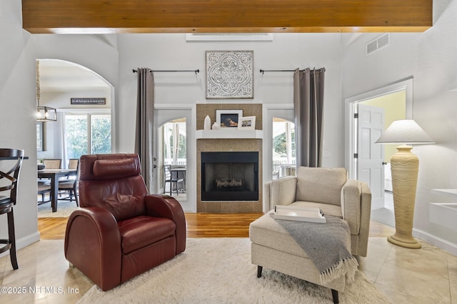 4 Pamela Pkwy, Palm Coast, FL 32137 - living room featuring visible vents and a tile fireplace