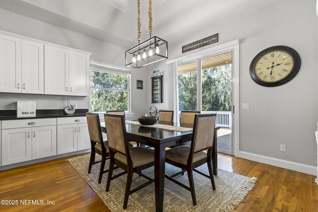4 Pamela Pkwy, Palm Coast, FL 32137 - dining space with dark wood-style floors and baseboards